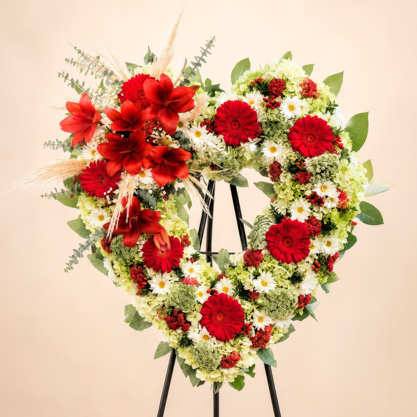 CORONA CORAZÓN ORTENCIAS Y GERBERAS ROJAS
