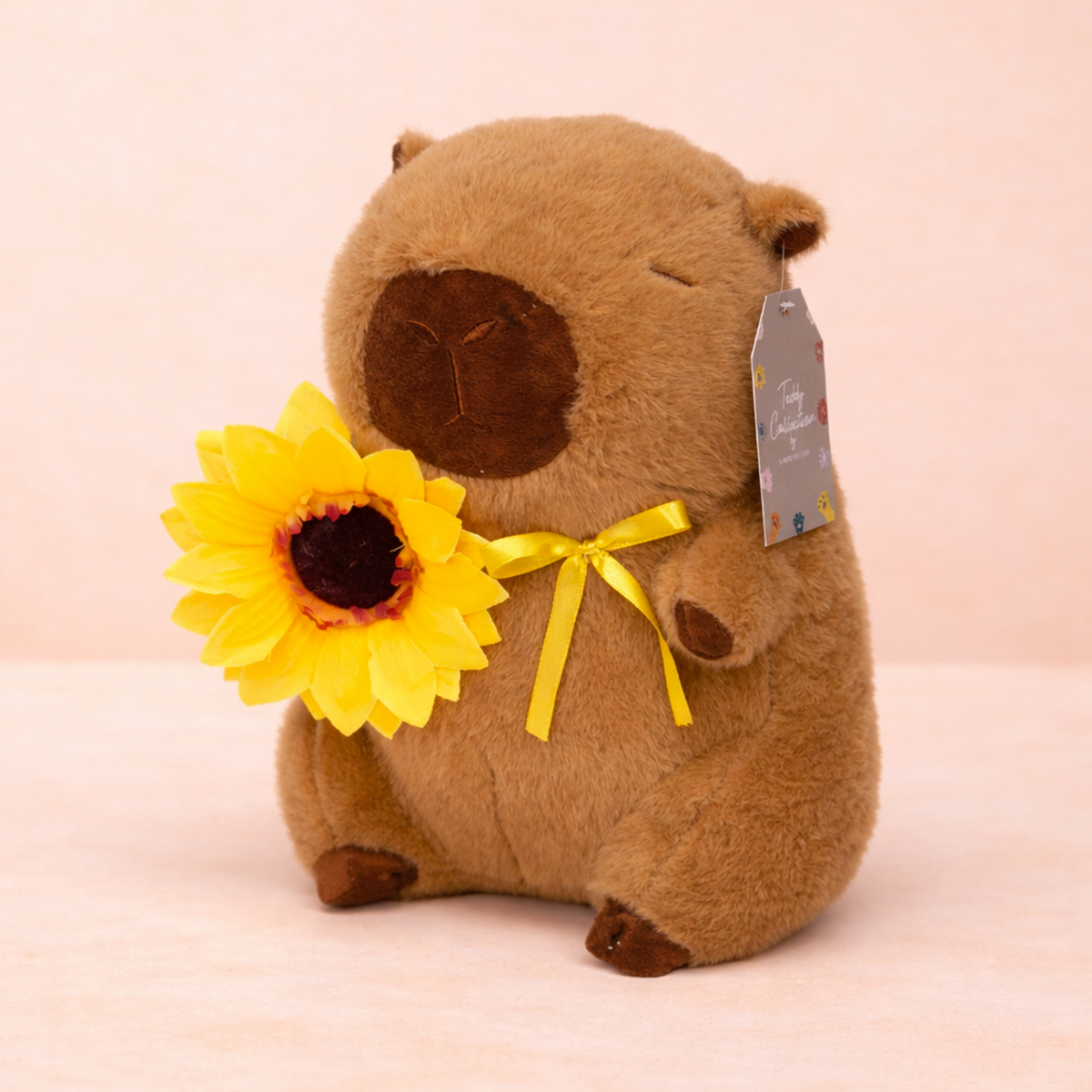 PELUCHE CAPIBARA CON GIRASOL