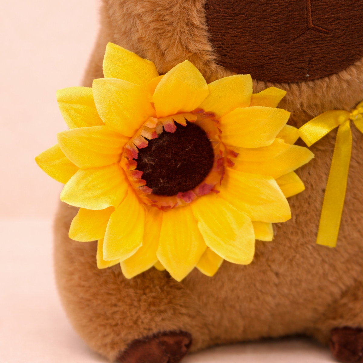 PELUCHE CAPIBARA CON GIRASOL